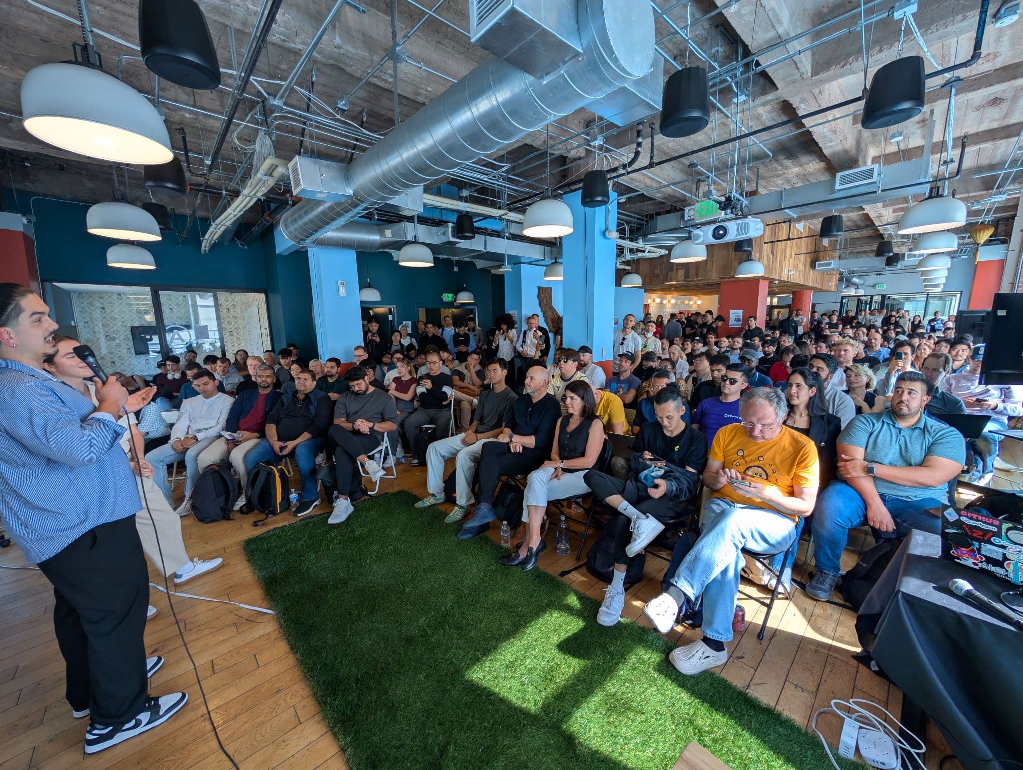 Packed audience at a Vibe Space in-person demo day